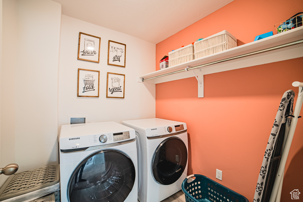Washroom with washing machine and clothes dryer