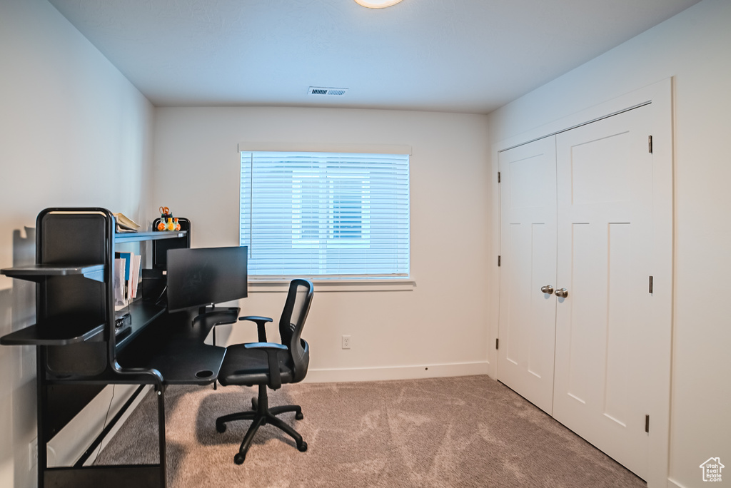 Office space featuring carpet floors and baseboards