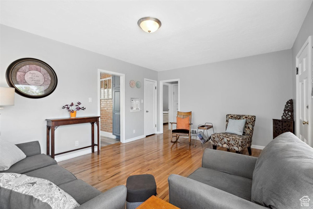 Living room with light wood finished floors and baseboards