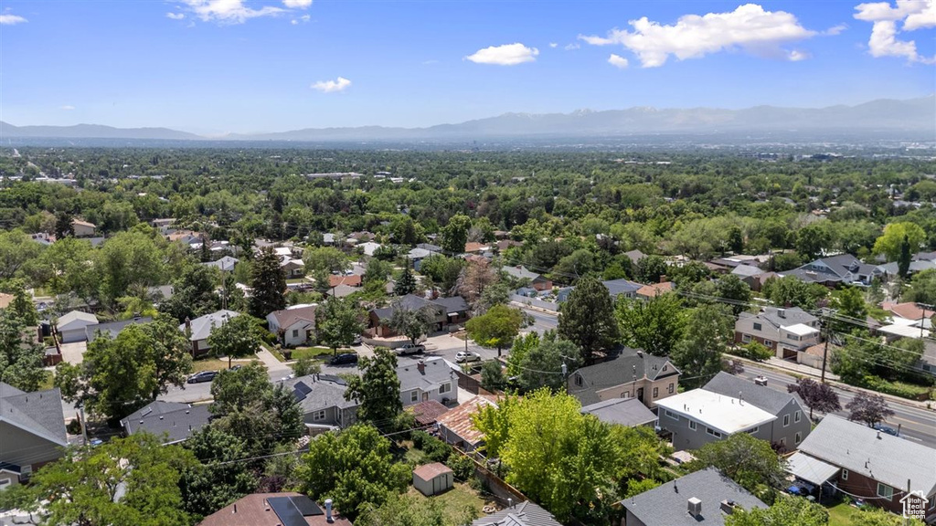 Aerial view of residential area featuring mountains