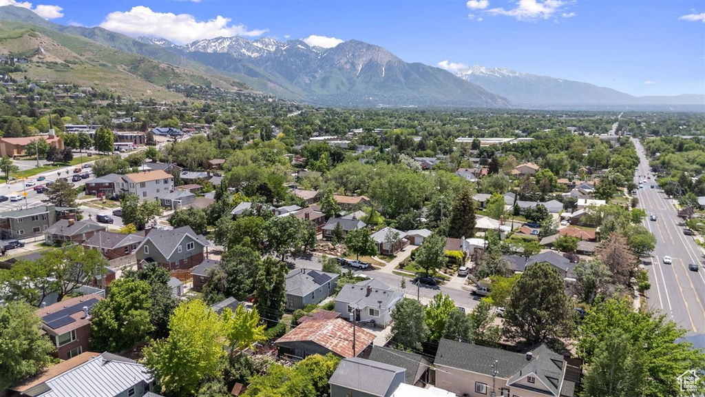 Aerial perspective of suburban area featuring a mountain backdrop
