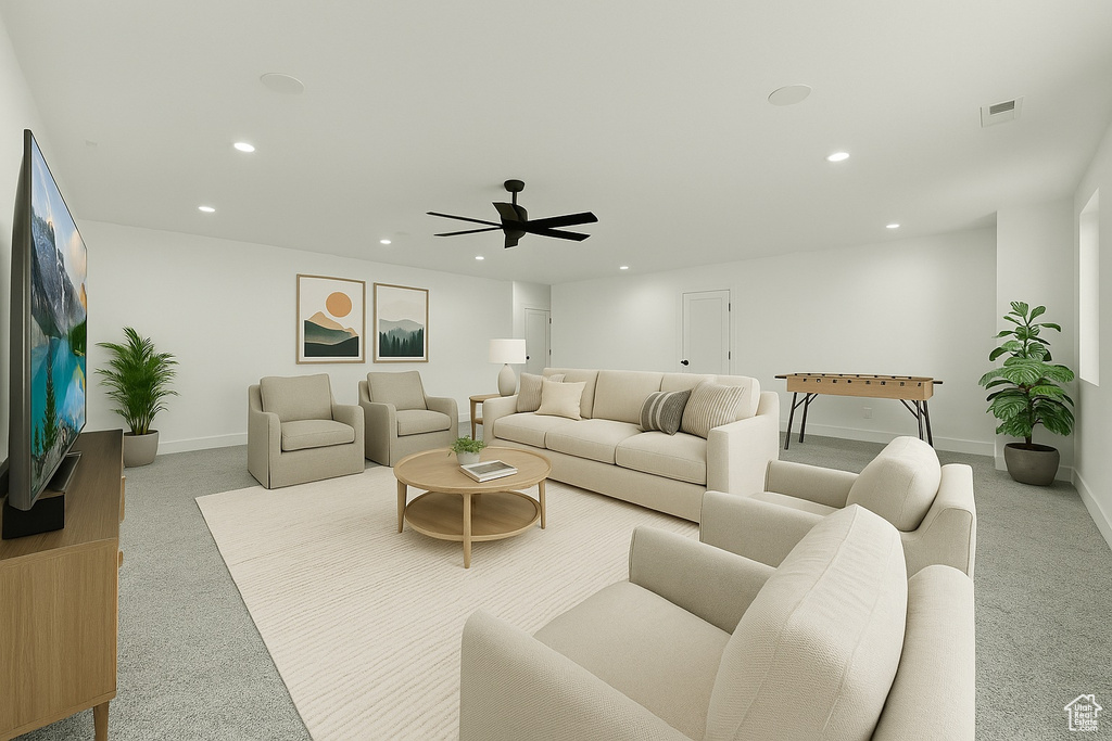 Living area with carpet flooring, recessed lighting, baseboards, and ceiling fan