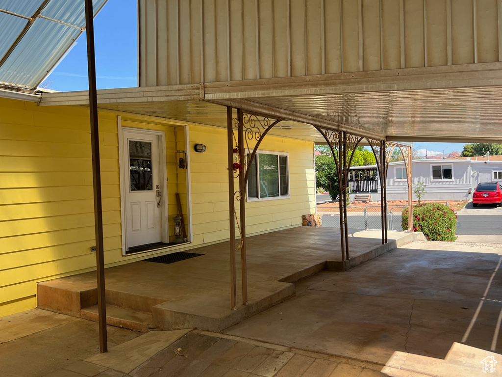 View of patio / terrace featuring a carport
