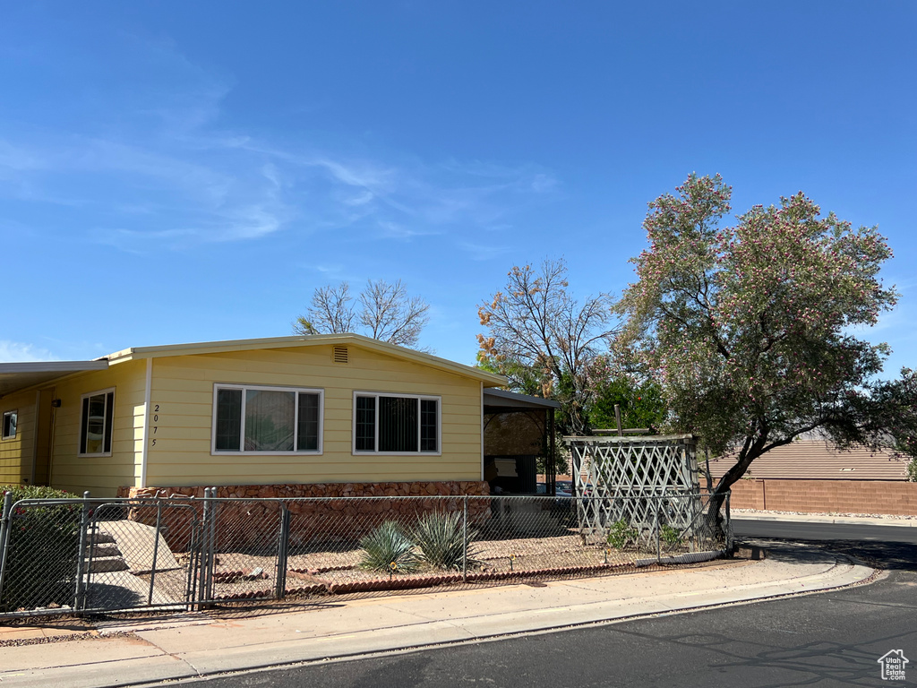 View of front of property with a fenced front yard