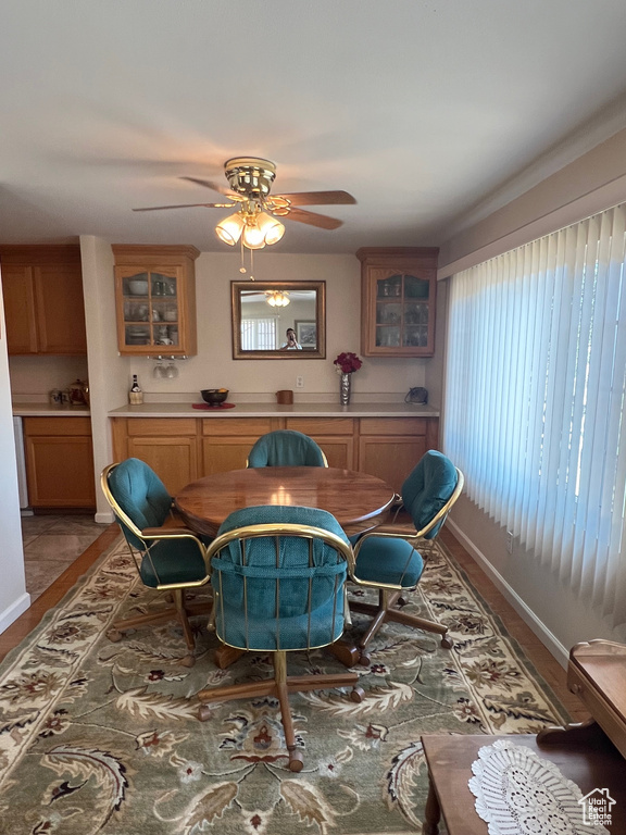 Dining space with a ceiling fan