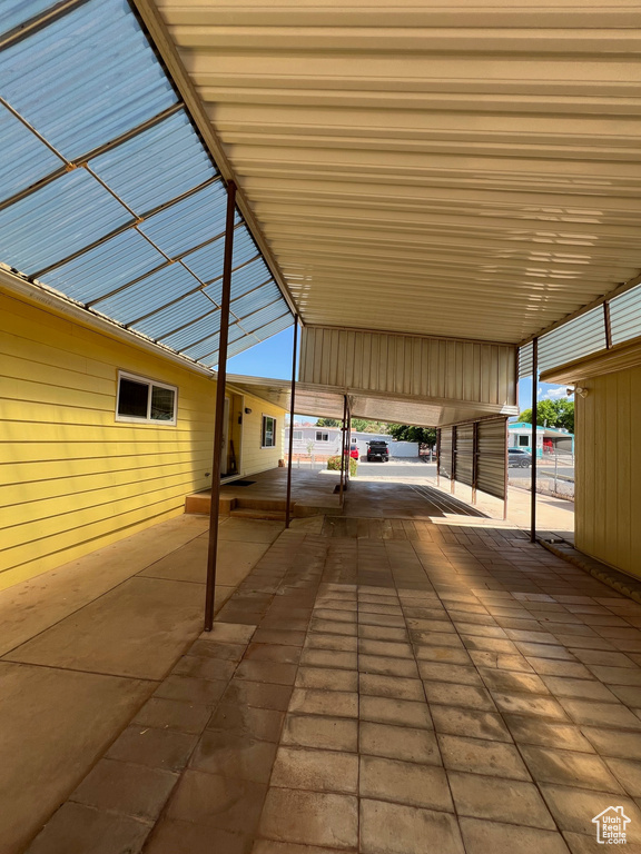 View of patio / terrace featuring a carport