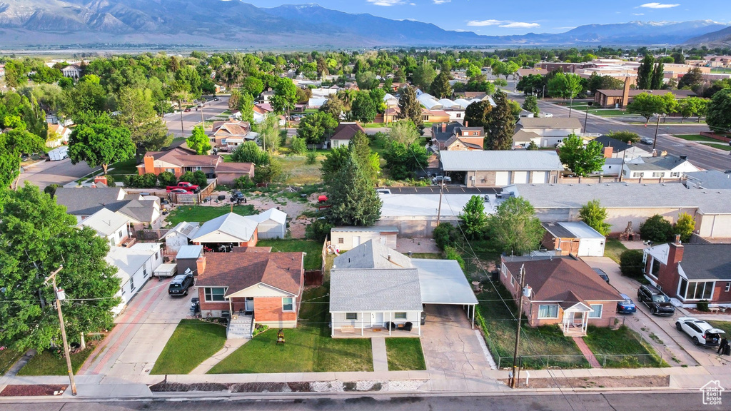 Aerial perspective of suburban area with a mountain backdrop