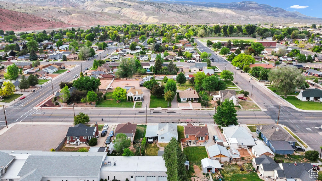 Aerial perspective of suburban area featuring a mountainous background