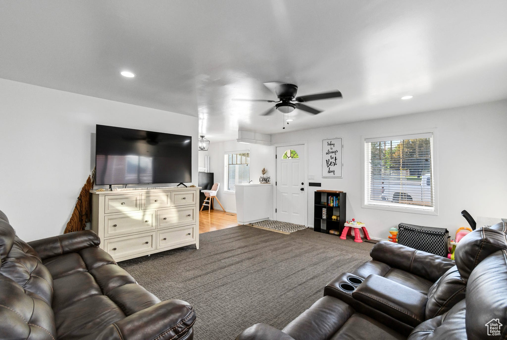 Living area featuring plenty of natural light, ceiling fan, and recessed lighting