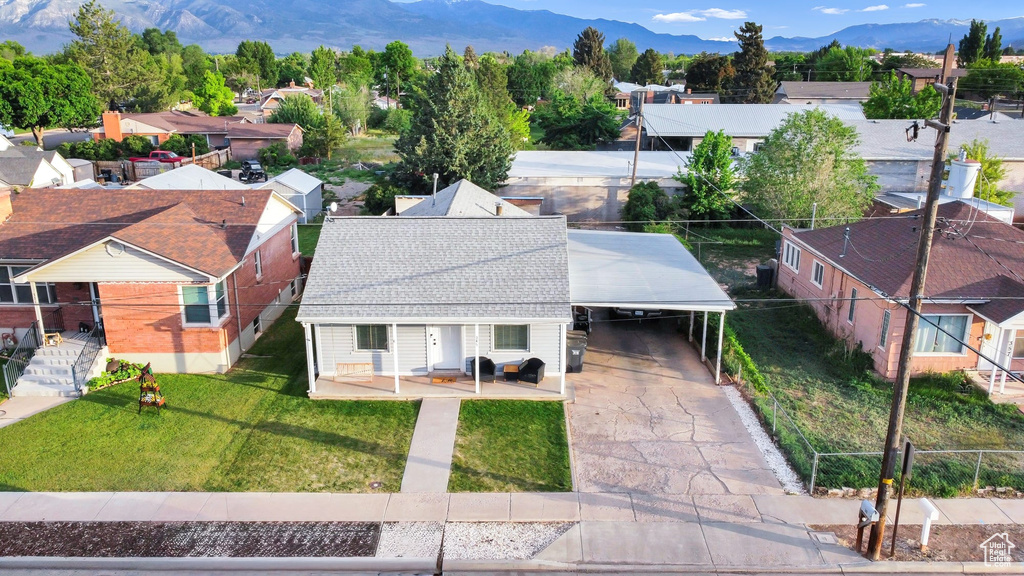 Aerial view of residential area featuring a mountain backdrop