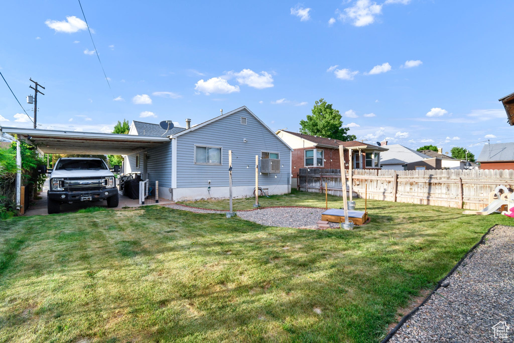 Rear view of house with a carport