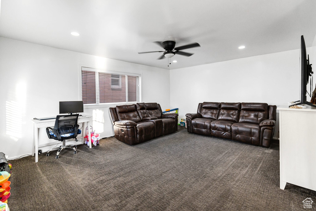 Living room featuring carpet floors, ceiling fan, and recessed lighting