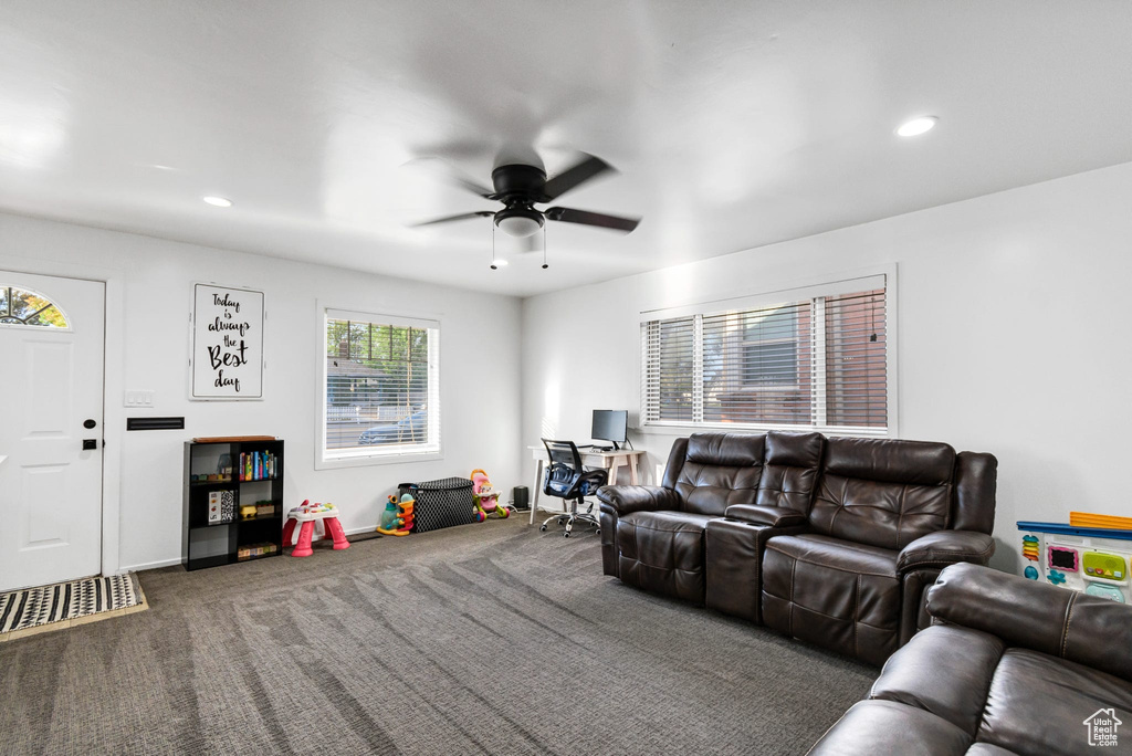 Living room featuring a ceiling fan, carpet floors, recessed lighting, and baseboards