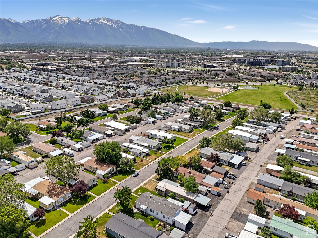 Aerial perspective of suburban area featuring a mountainous background