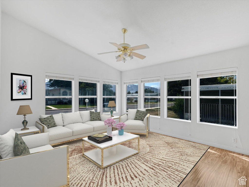 Sunroom / solarium featuring vaulted ceiling