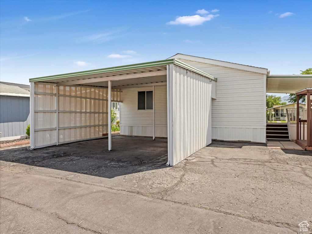 Garage featuring a carport