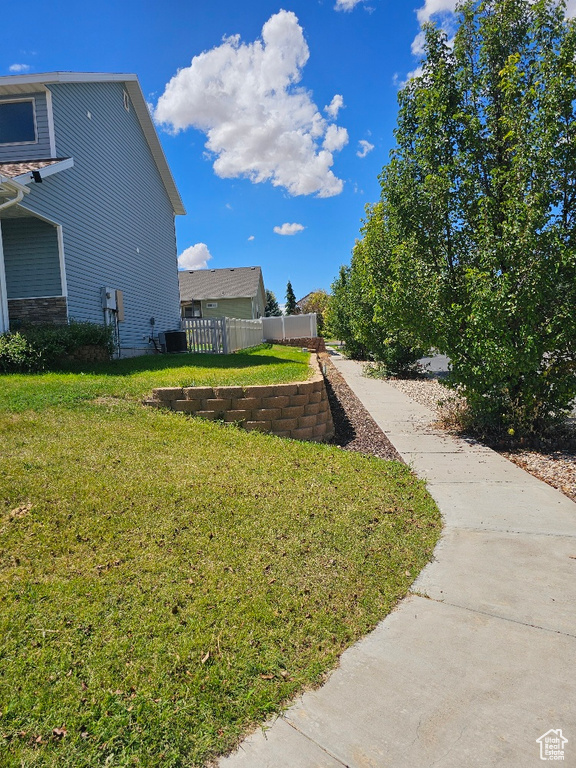 View of yard with central AC unit
