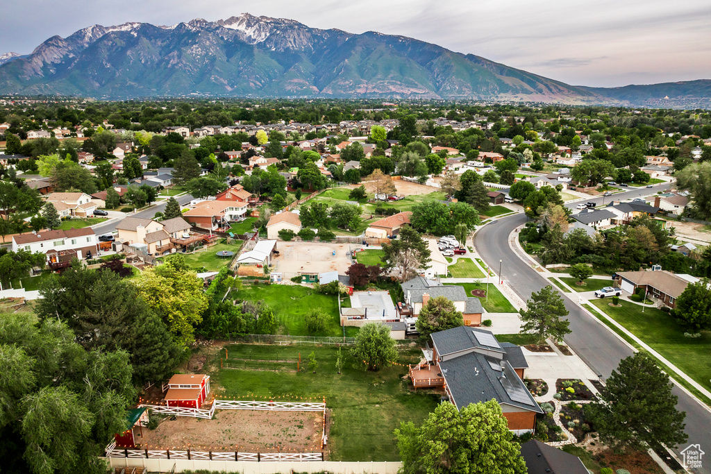 Aerial view of residential area featuring a mountainous background