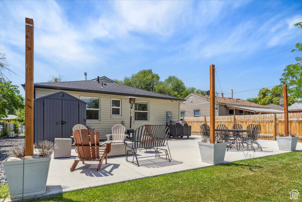 Back of house with a patio area