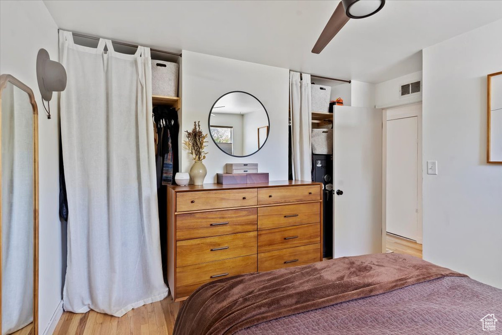 Bedroom with light wood-style flooring and ceiling fan