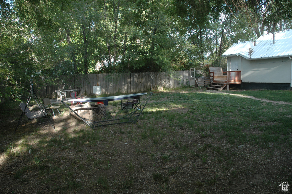 View of yard featuring a wooden deck