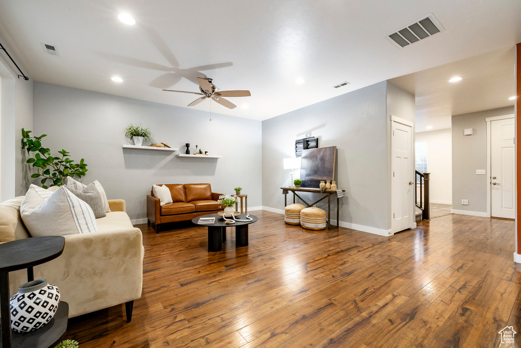 Living room featuring ceiling fan, wood-type flooring, recessed lighting, and baseboards