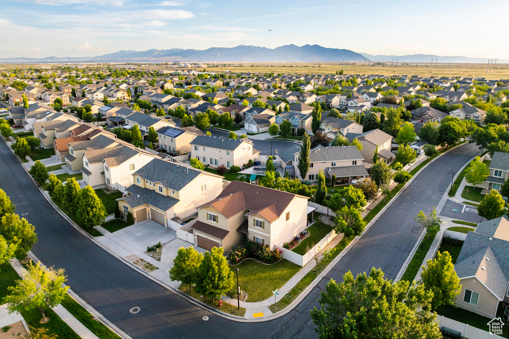 Aerial view of residential area featuring a mountain backdrop