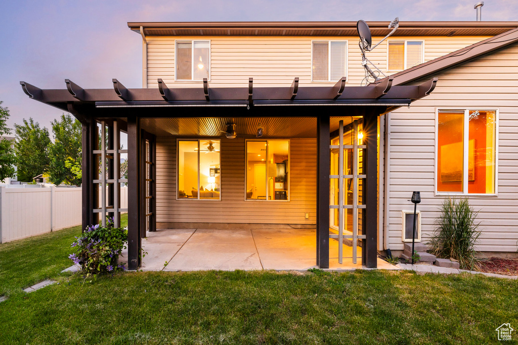 Rear view of property featuring a patio