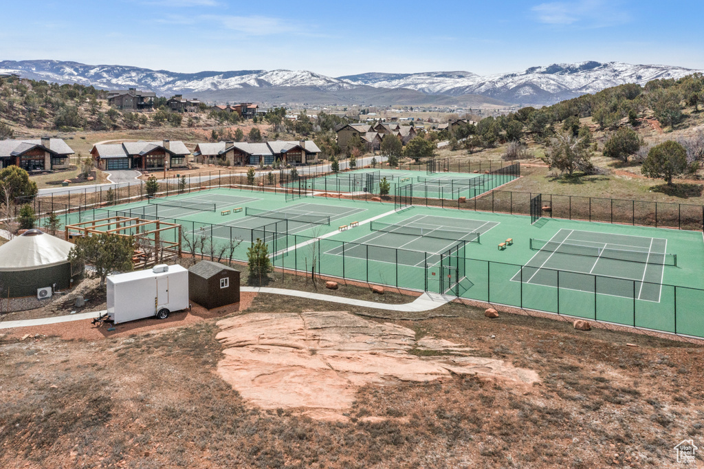 View of tennis court featuring a mountain view
