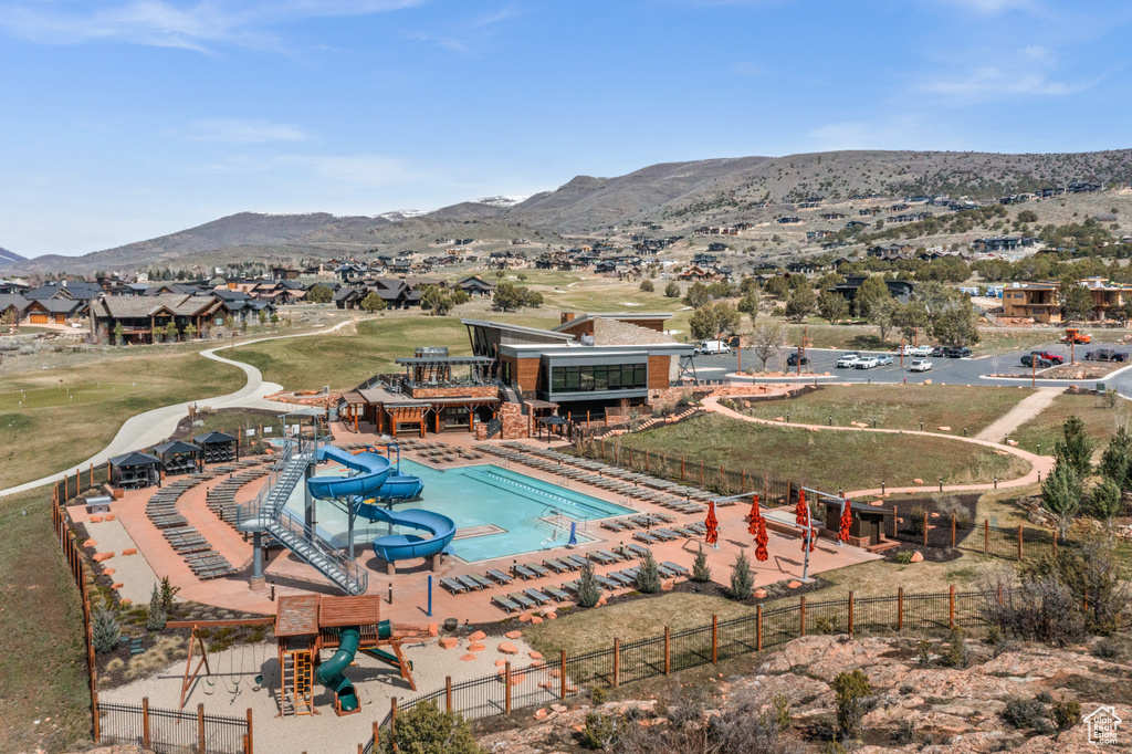 View of swimming pool with a mountain view and a residential view