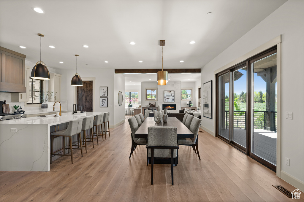 Dining space featuring recessed lighting, light wood-style flooring, and baseboards