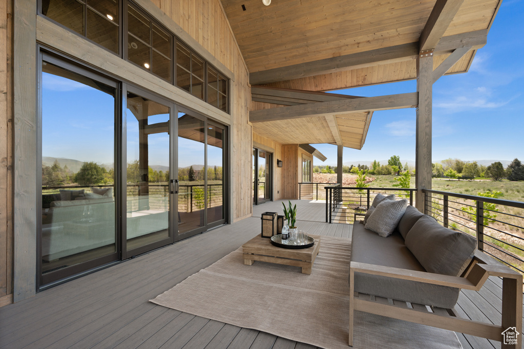 Wooden terrace with an outdoor hangout area