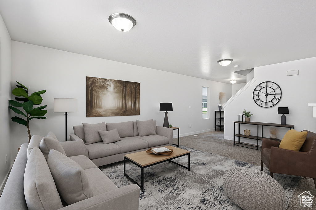 Living area with carpet and baseboards