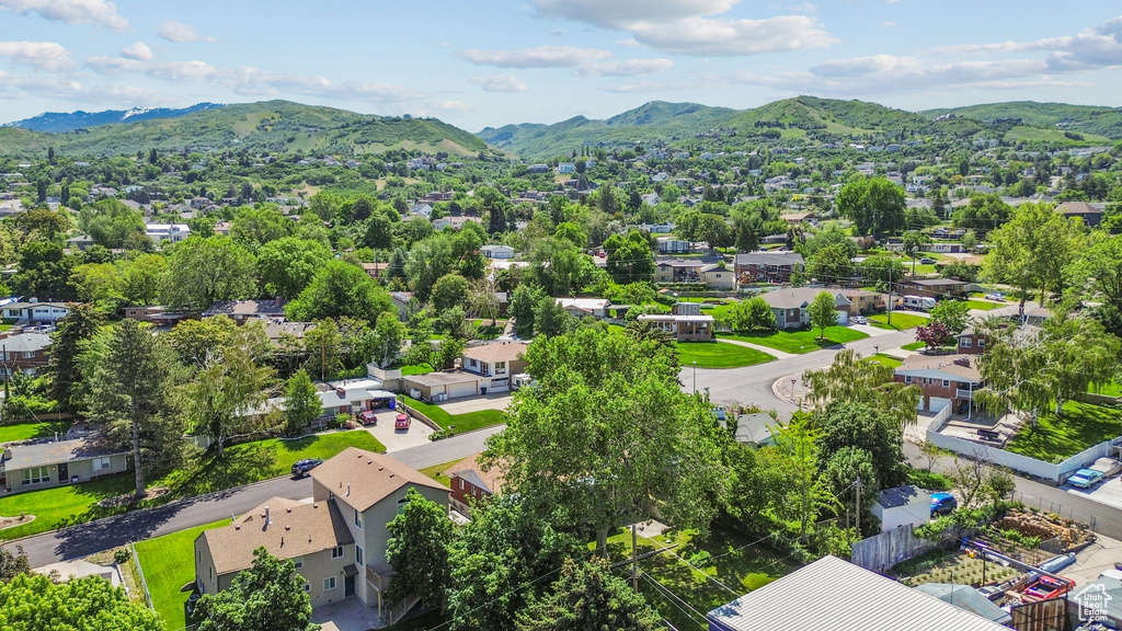 Aerial perspective of suburban area with a mountain backdrop