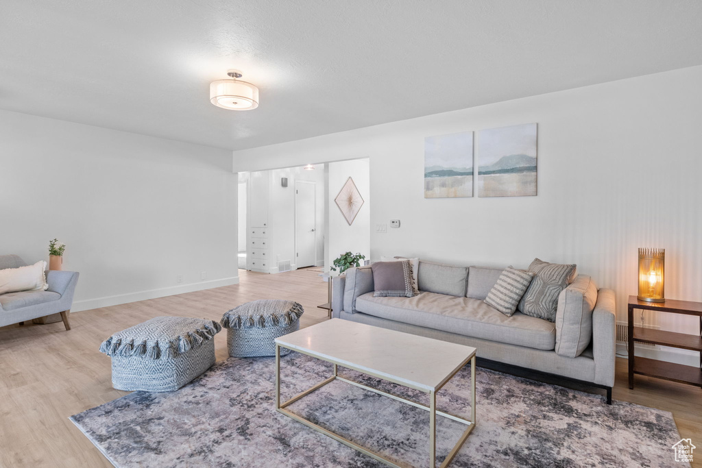 Living area featuring wood finished floors and baseboards