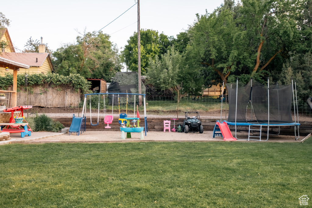 View of play area featuring a trampoline