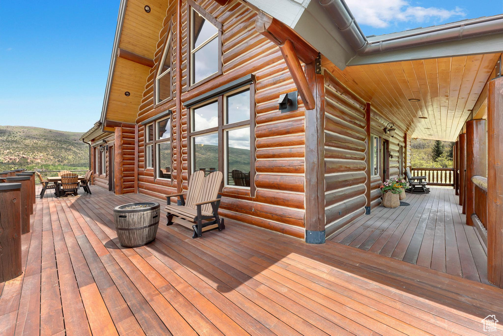 Wooden deck featuring outdoor dining area