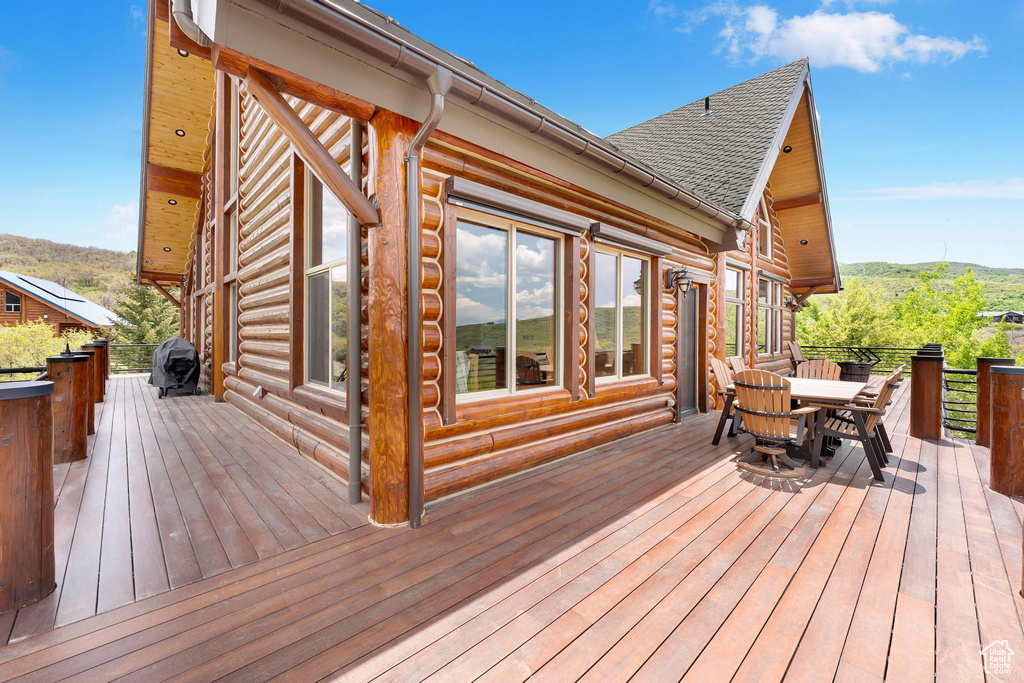 Wooden deck with outdoor dining space