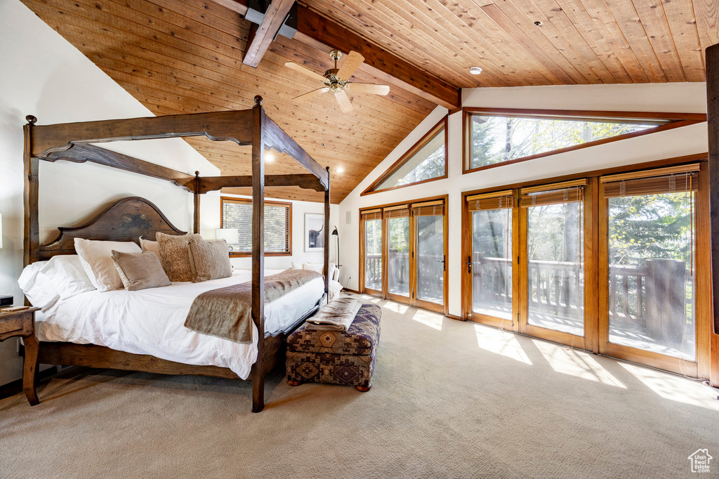Carpeted bedroom with access to outside and wooden ceiling