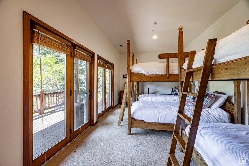 Bedroom with carpet floors, access to exterior, and french doors