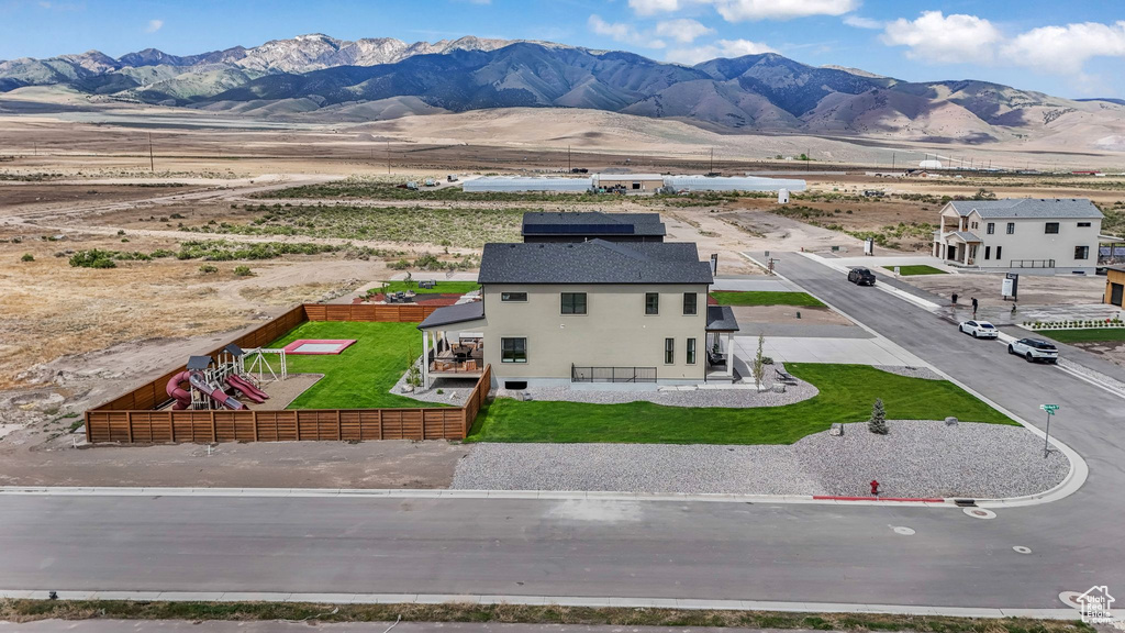 View of subject property with mountains