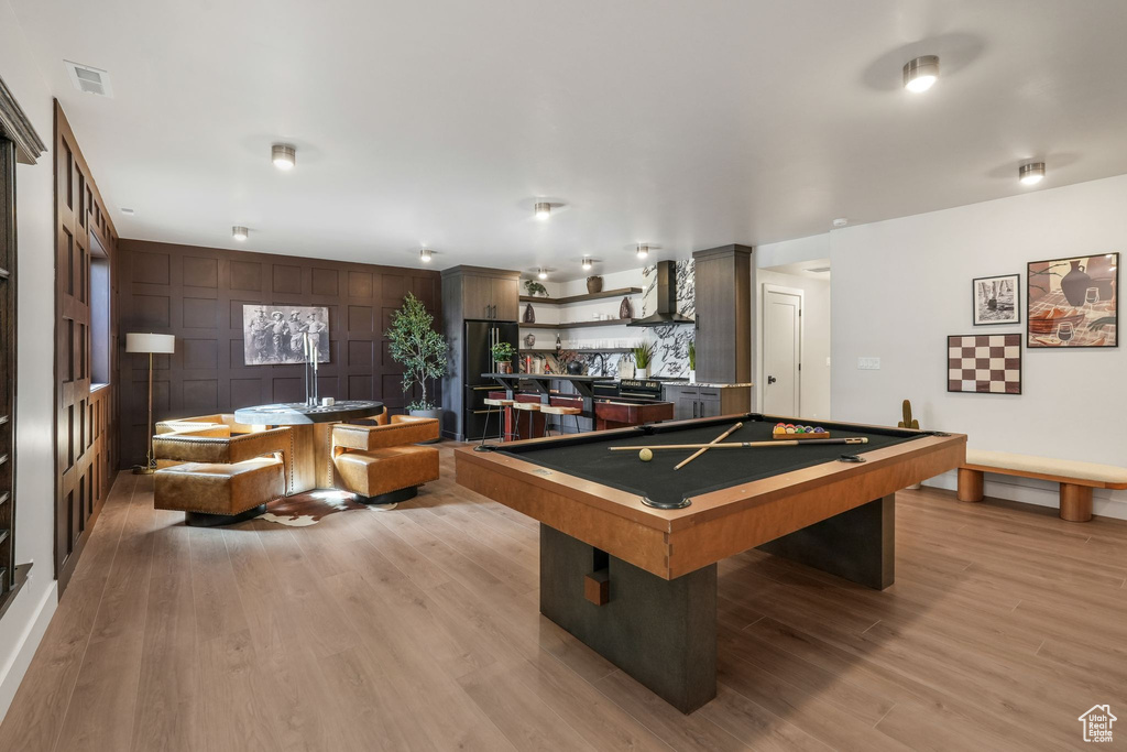 Playroom featuring light wood finished floors and billiards
