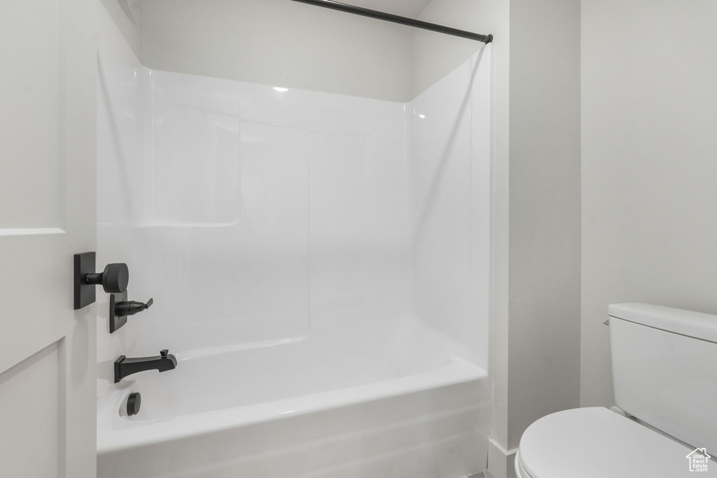 Full bathroom with toilet and shower / bathtub combination