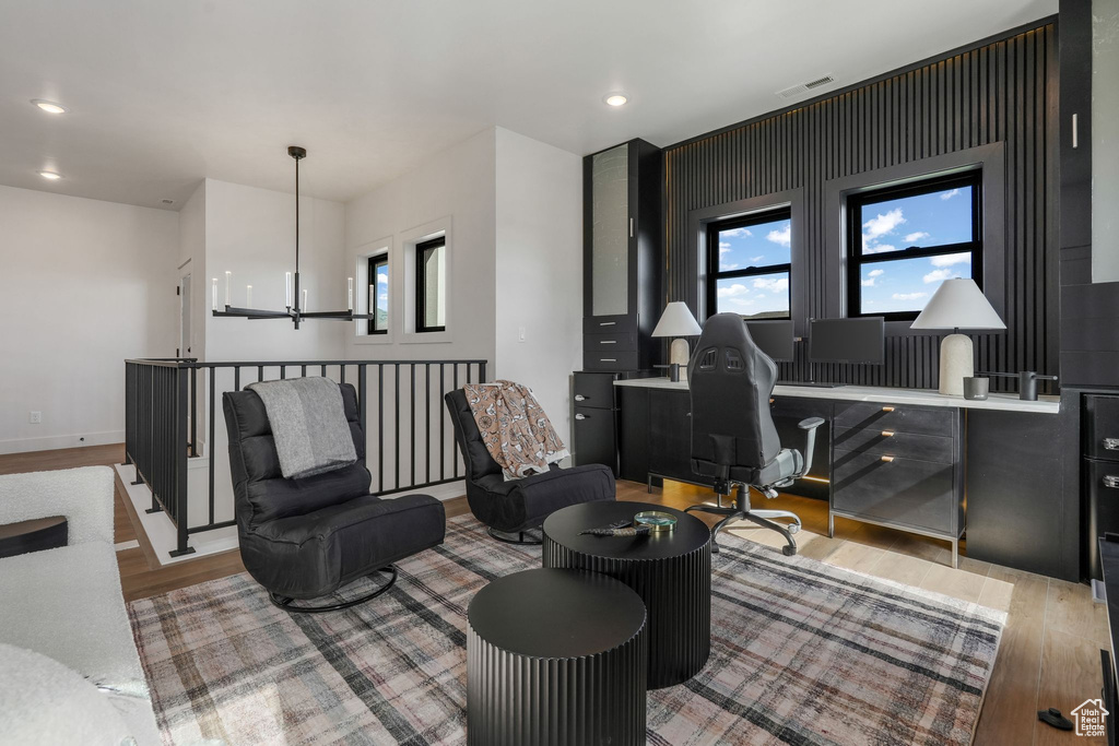 Living area featuring light wood-style flooring, a desk, plenty of natural light, and recessed lighting