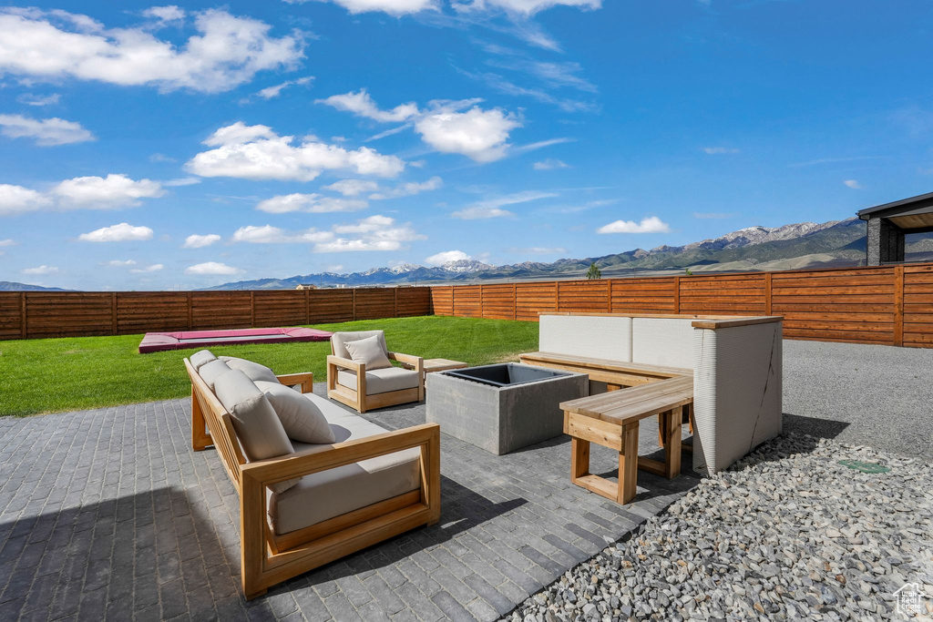 View of patio featuring outdoor lounge area and a mountain view
