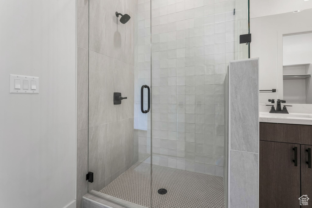 Full bathroom with a shower stall and vanity