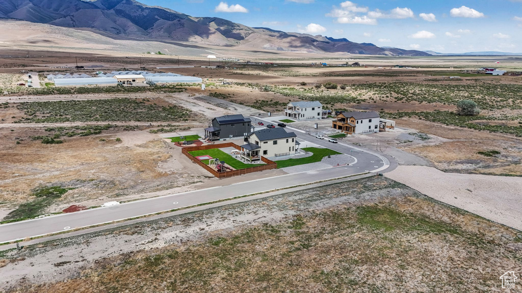 Overview of rural landscape featuring a mountain backdrop