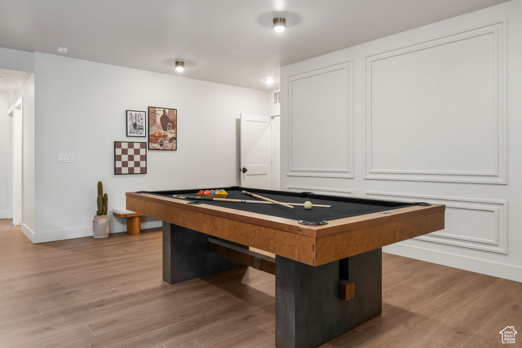 Recreation room featuring billiards table, baseboards, and light wood-style flooring