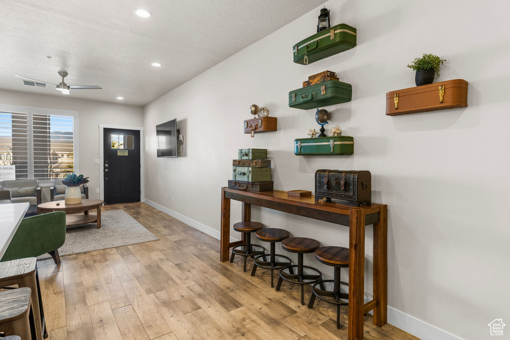 Entrance foyer with baseboards, light wood-type flooring, recessed lighting, and ceiling fan