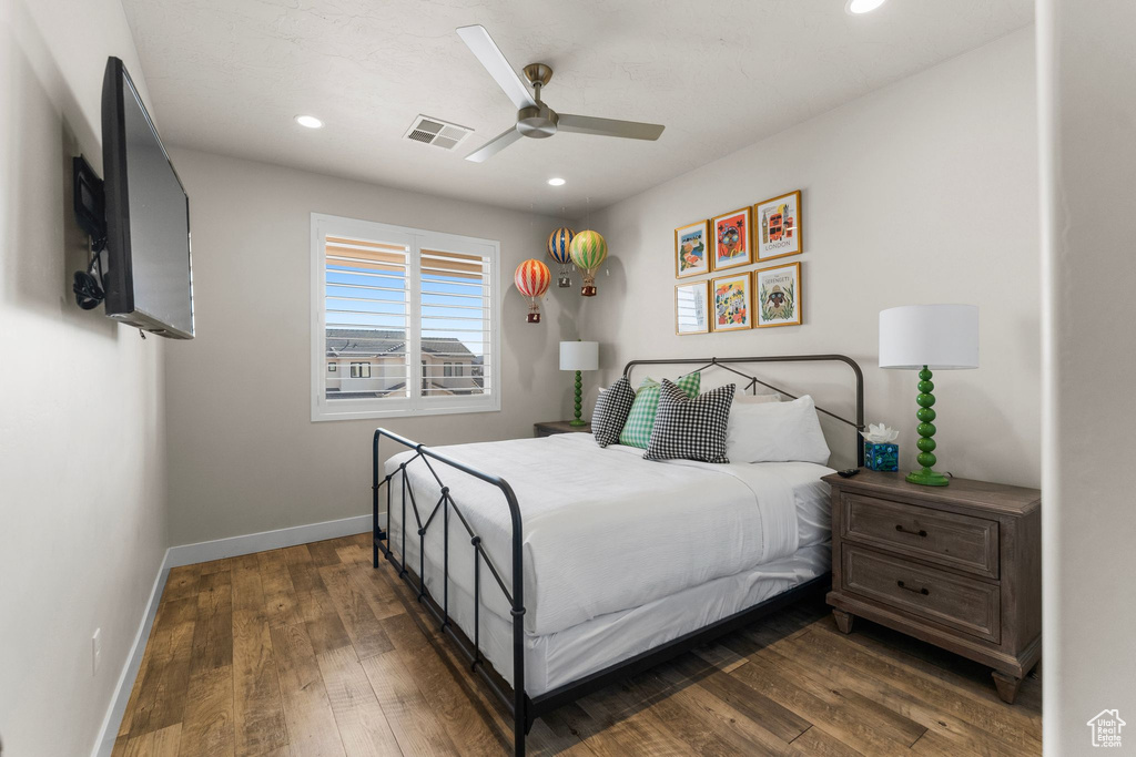 Bedroom featuring baseboards, wood finished floors, recessed lighting, and ceiling fan
